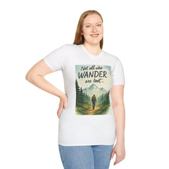Woman wearing Montana-Inspired Adventure Tee with scenic wilderness graphic and "Not all who wander are lost" quote.
