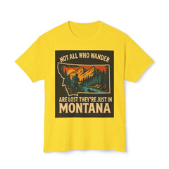 Yellow Montana Adventure Tee with nature-themed design and "Not All Who Wander Are Lost They're Just in Montana" slogan. Softstyle, ethically sourced.