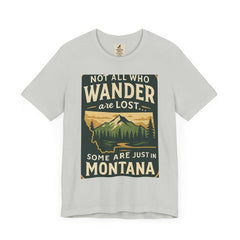 Scenic "Get Lost in Montana Tee" showcasing vintage-style graphic of Montana's wilderness, ideal for outdoor enthusiasts.