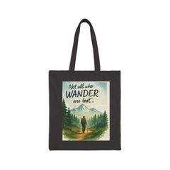 Eco-friendly Adventure Tote Bag with mountain and hiker design, reading "Not all who wander are lost," made from durable cotton canvas for nature lovers and hikers.