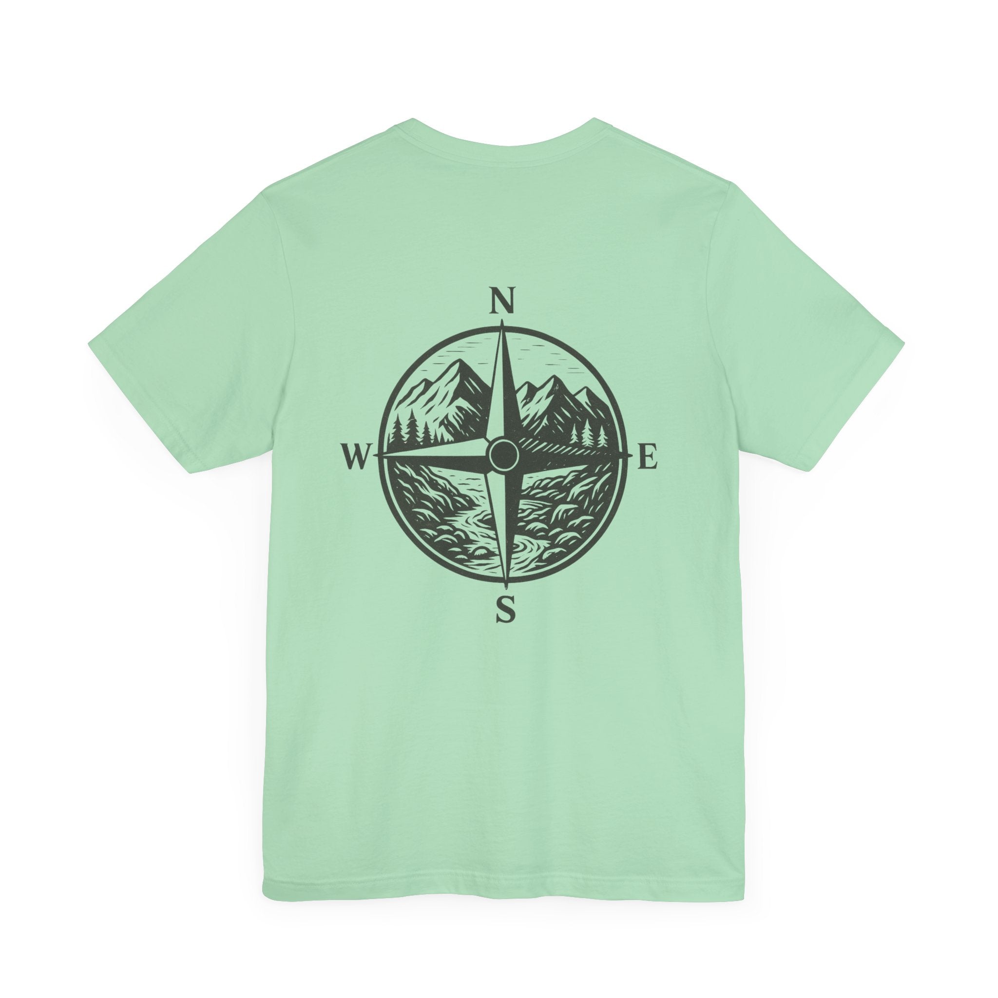 Scenic mountain compass graphic on mint-colored "Get Lost in Montana Tee" for outdoor explorers.