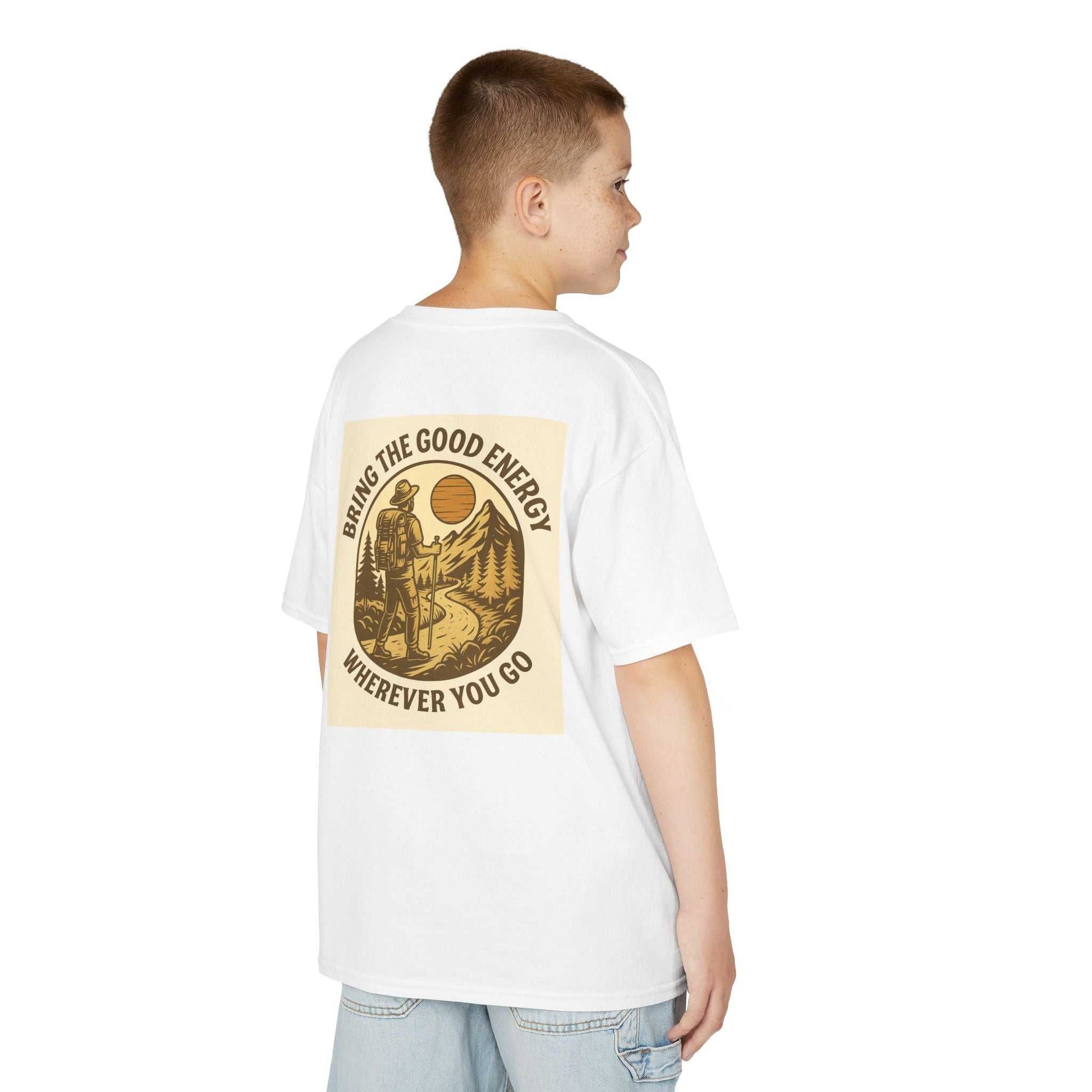 Kid wearing the Adventure Kids Tee with nature-inspired print and motivational message.