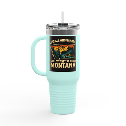 Large blue Montana Adventure Mug with ergonomic handle and leak-proof lid, featuring a wilderness design.