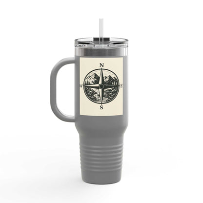 40oz Montana Compass Travel Mug with compass design, insulated for hot/cold drinks, rust-resistant stainless steel, ergonomic handle, leak-proof lid.